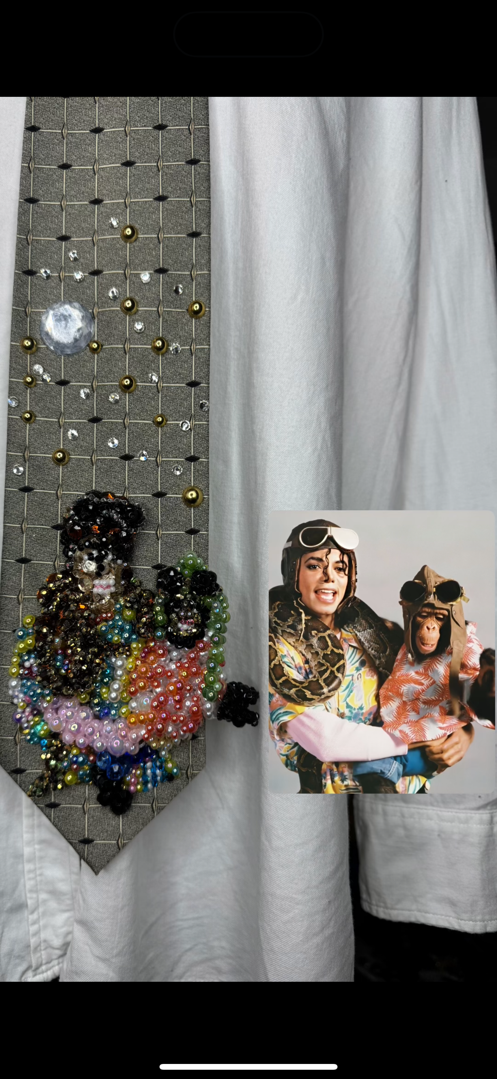 Olive Green Michael Jackson Holding Bubbles and Boa Constrictor Both Wearing Pilot Googles for Leave Me Alone Music Video Tie