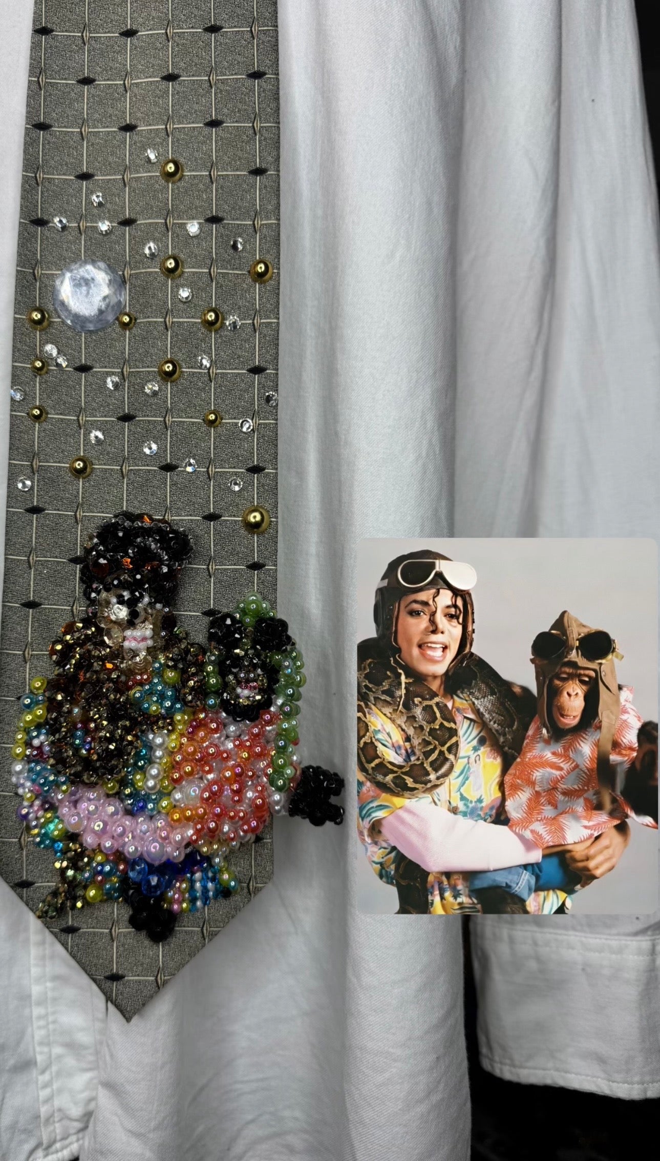Olive Green Michael Jackson Holding Bubbles and Boa Constrictor Both Wearing Pilot Googles for Leave Me Alone Music Video Tie