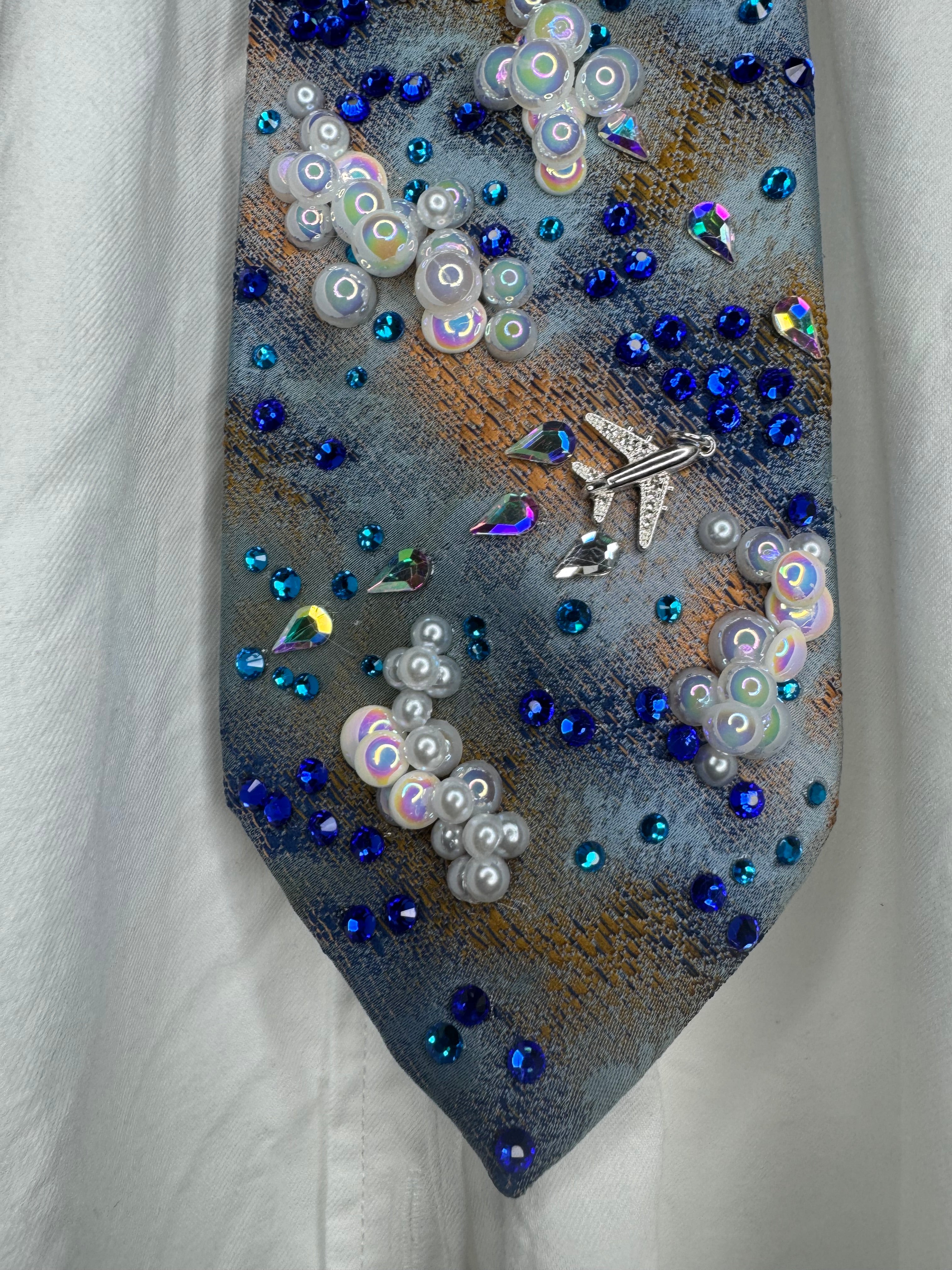 Blue and Orange Clouds and Airplanes Over Water Pilot Tie