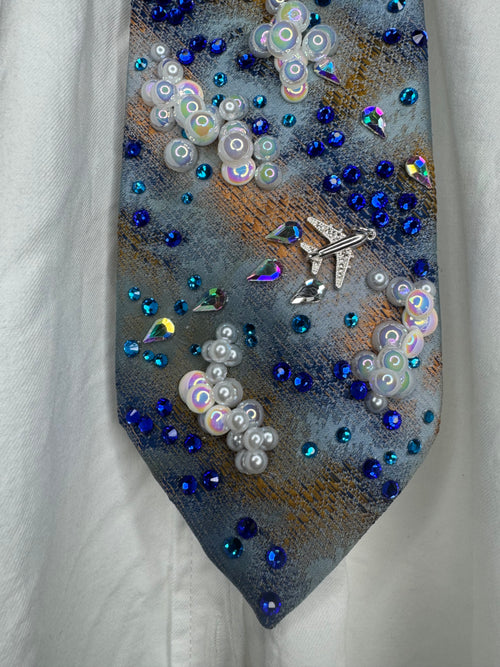 Blue and Orange Clouds and Airplanes Over Water Pilot Tie