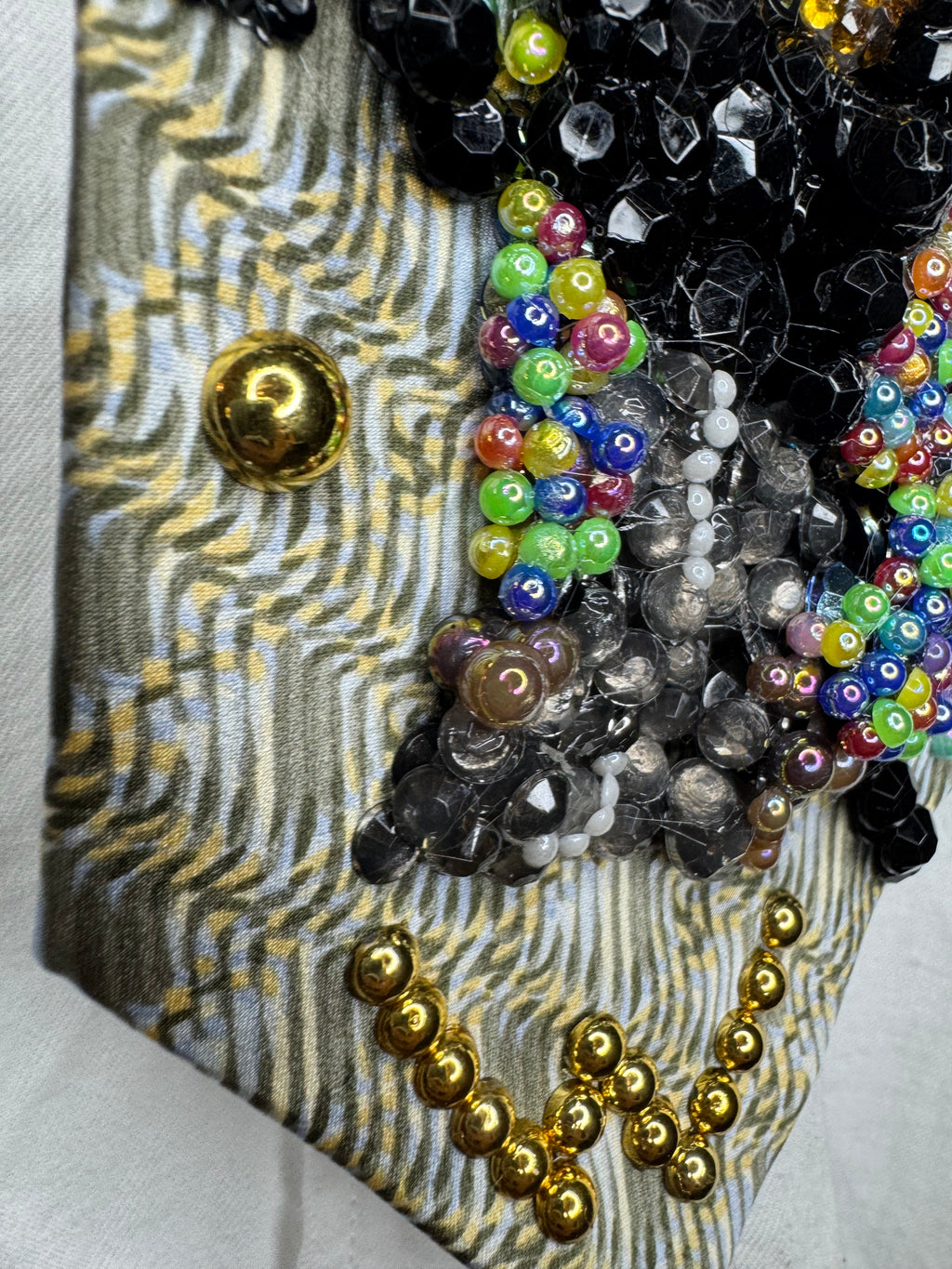 Beige Whitney Houston in Colorful Gem Jacket Posing on Staircase Tie