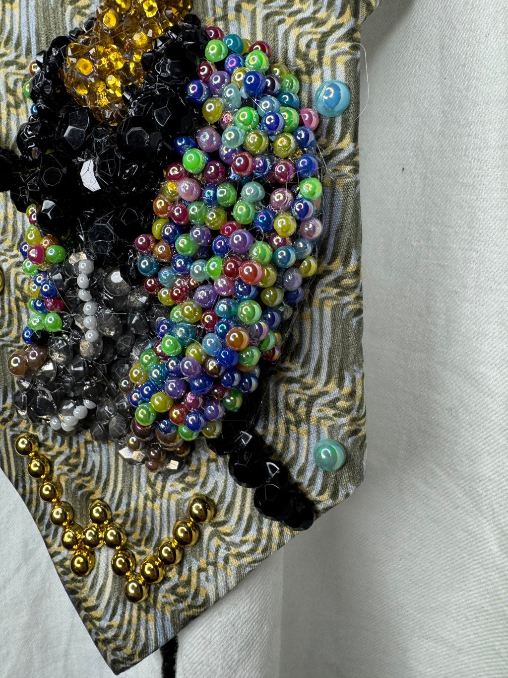 Beige Whitney Houston in Colorful Gem Jacket Posing on Staircase Tie