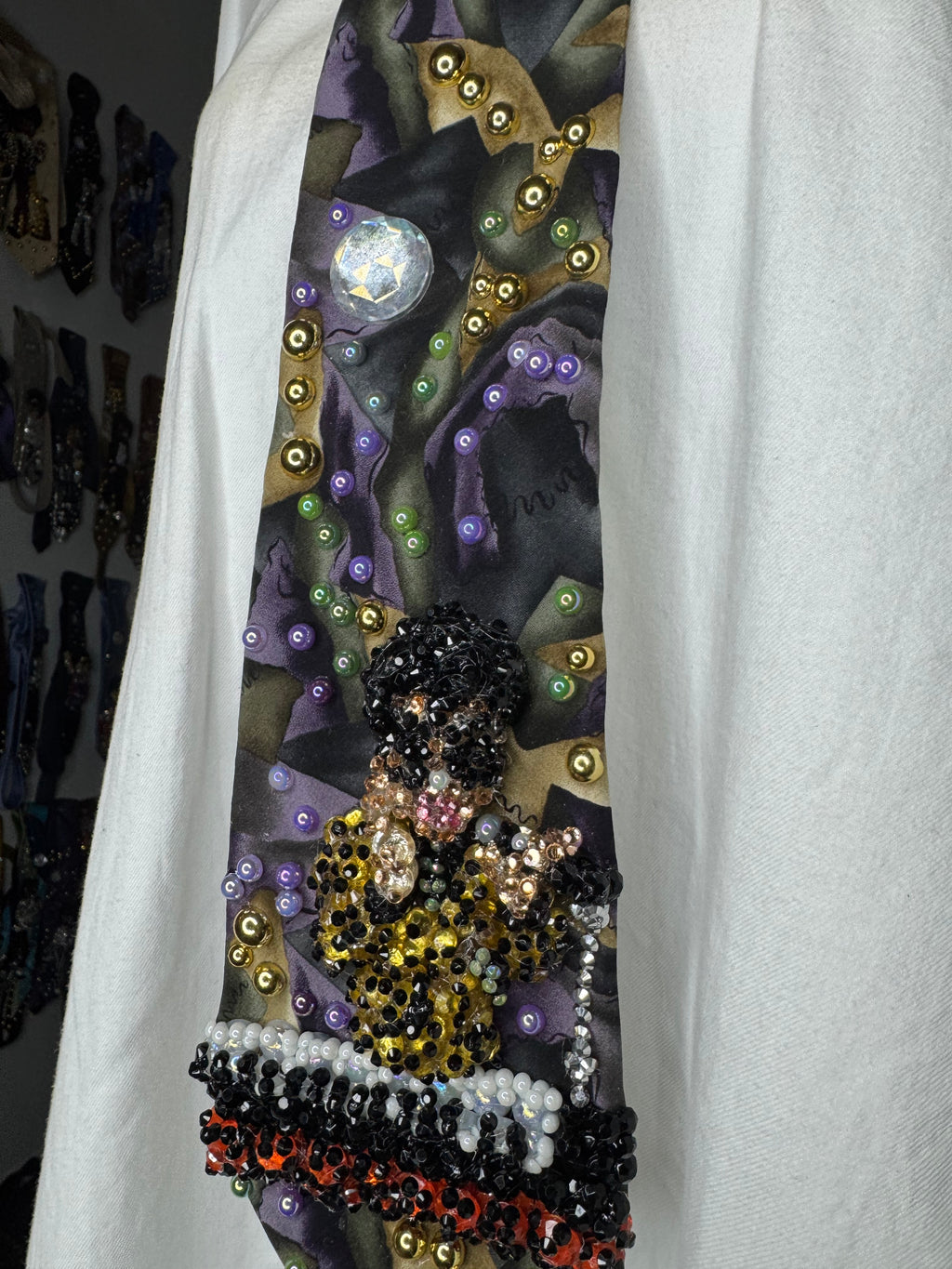 Purple Gold, and Green Marbled Prince in Full Yellow Polka Dot Suit Playing on Orange Cheetah Print Piano Live Tie