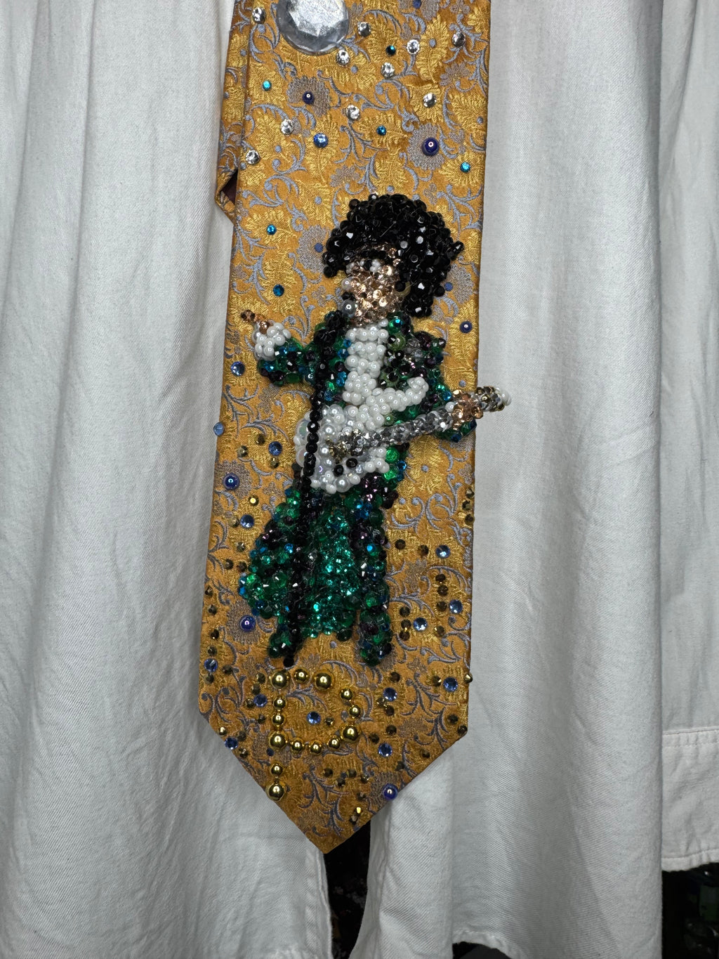 Gold Paisley Prince Pointing With White Guitar Performing Purple Rain at the AMA 1985 Tie