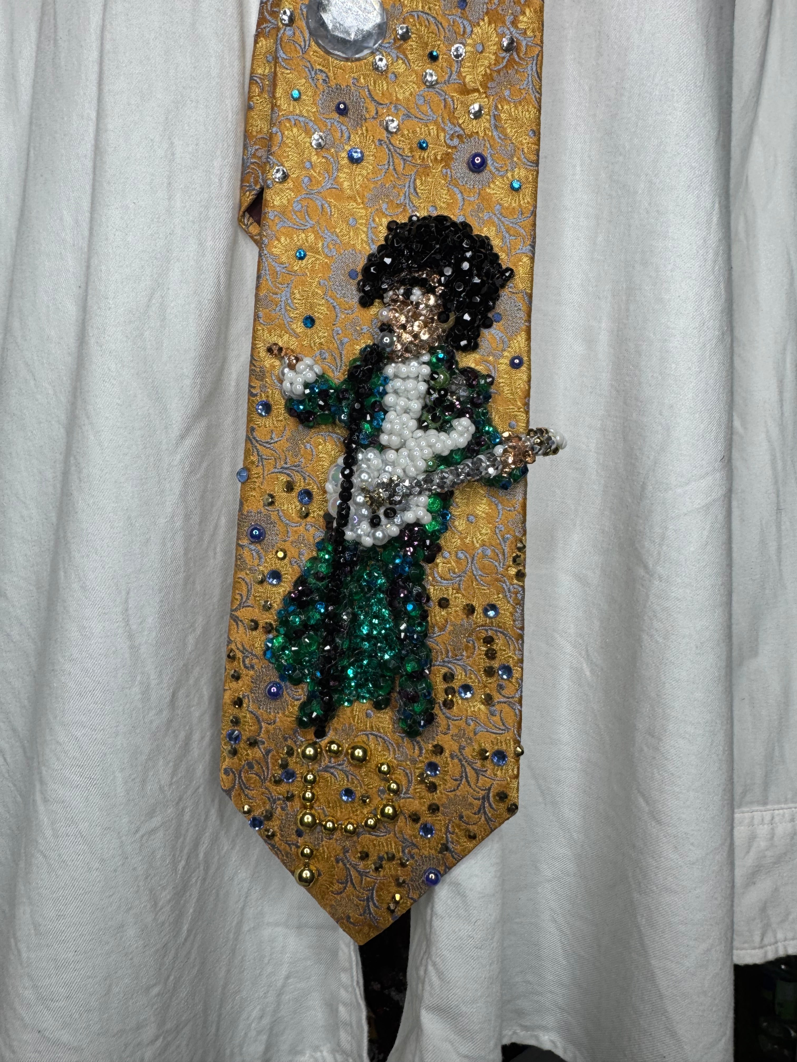 Gold Paisley Prince Pointing With White Guitar Performing Purple Rain at the AMA 1985 Tie