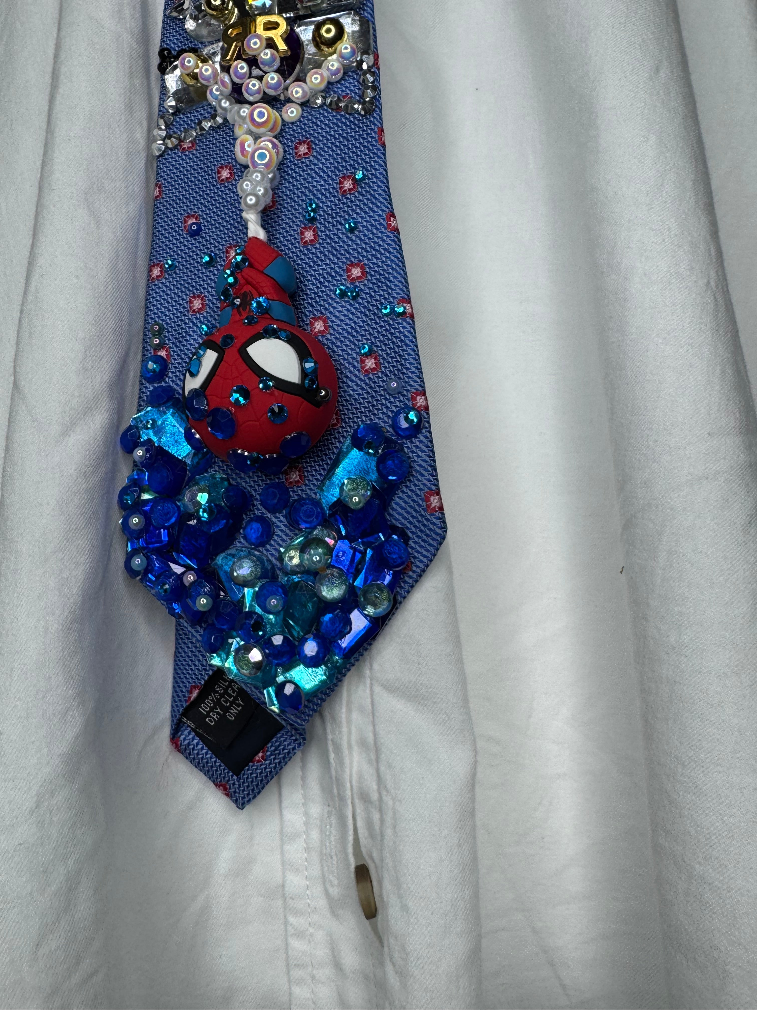 Blue Spiderman Webbing Himself Out of Water to Train Railway Tie
