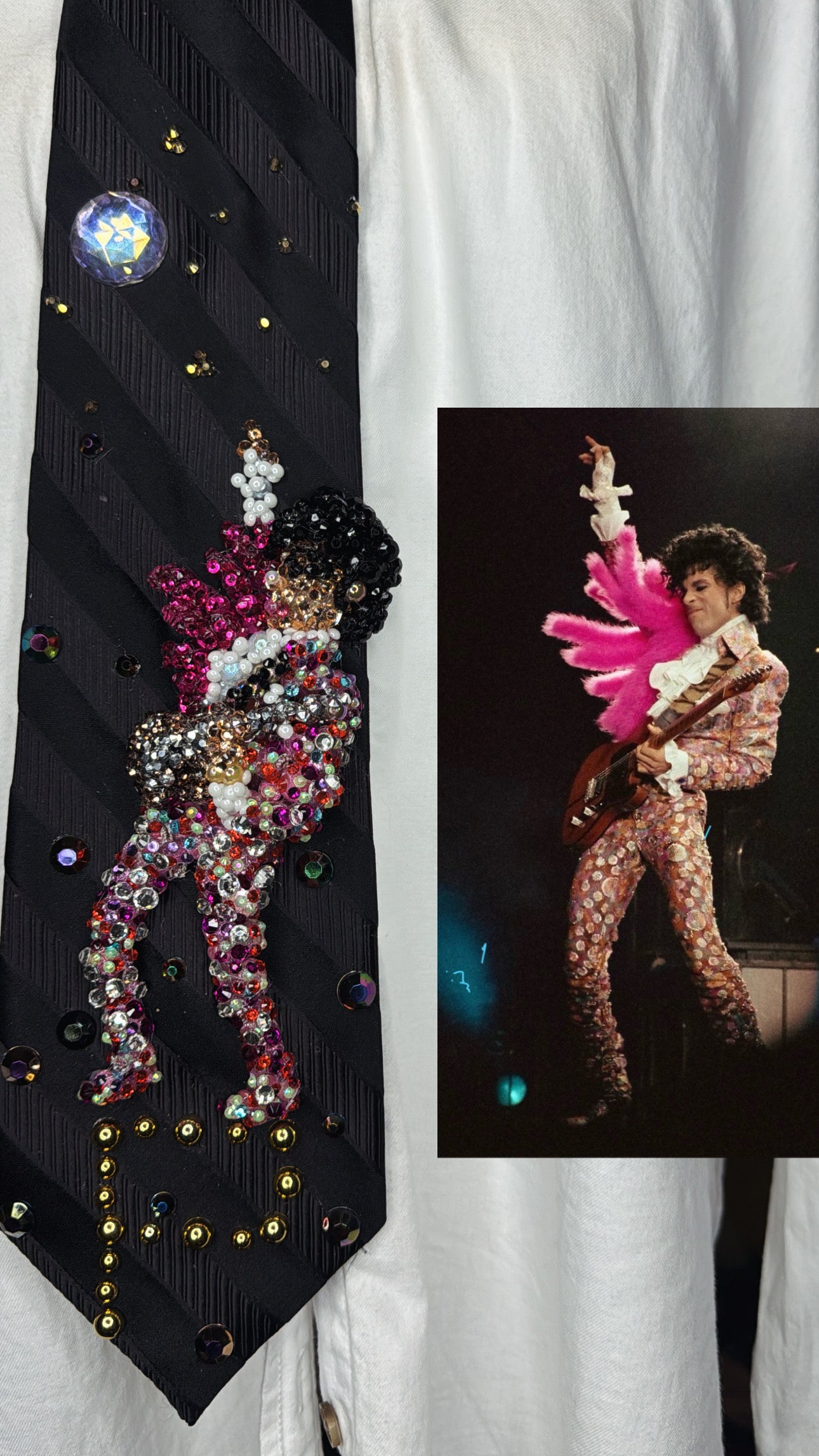 Black Striped Prince Rocking Out in Color Spotted Outfit with Pink Scarf Performing Tie