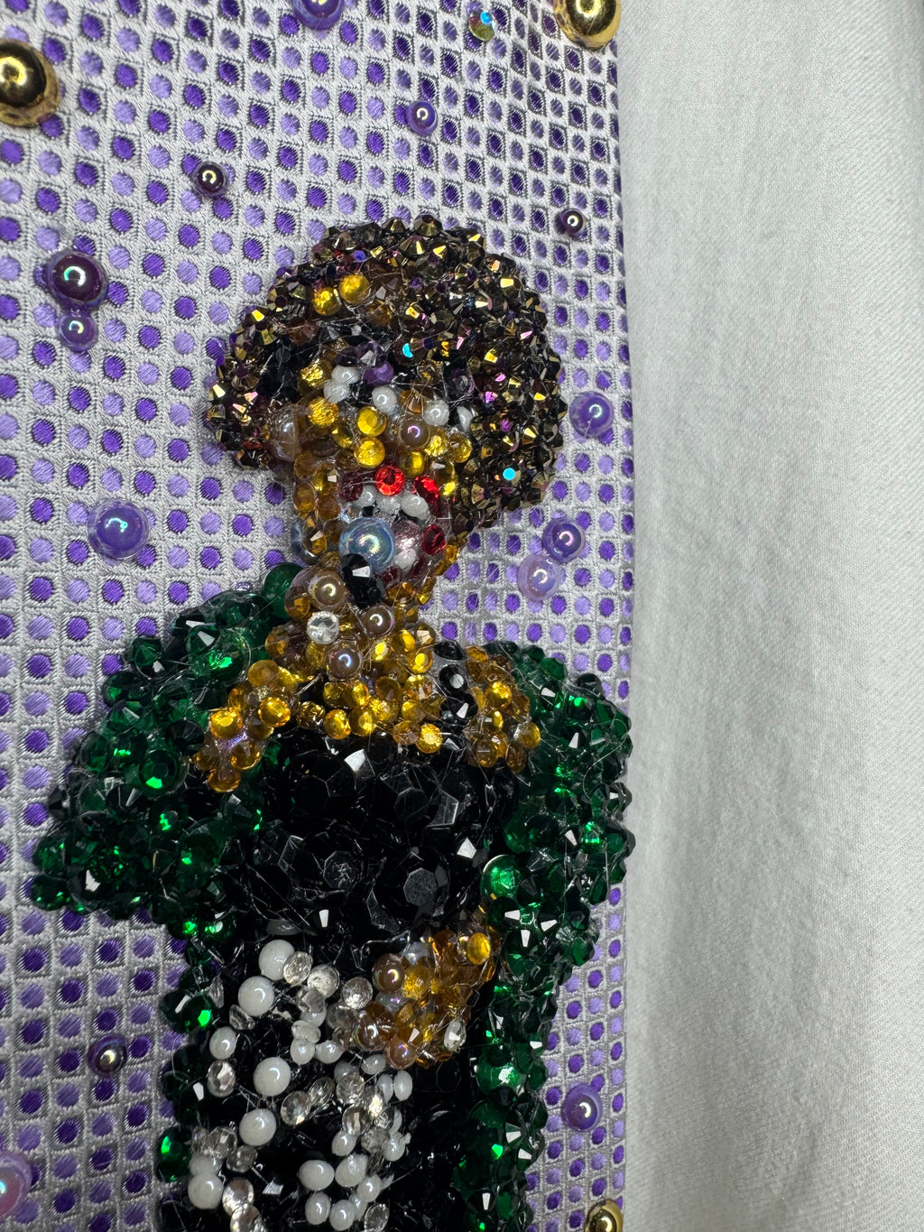 Purple Whitney Houston Performing In Black Floral Pants And Green Mink Coat Tie