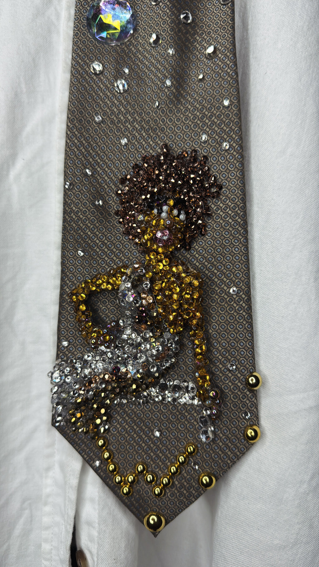 Brown Whitney Houston Posing on Clear Bench in Crystal Royalty Open Shoulder Dress For Photoshoot Tie