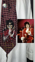 Red Prince Rocking Out in Red Outfit with Red Fuzzy Scarf on Brown Guitar Live Tie
