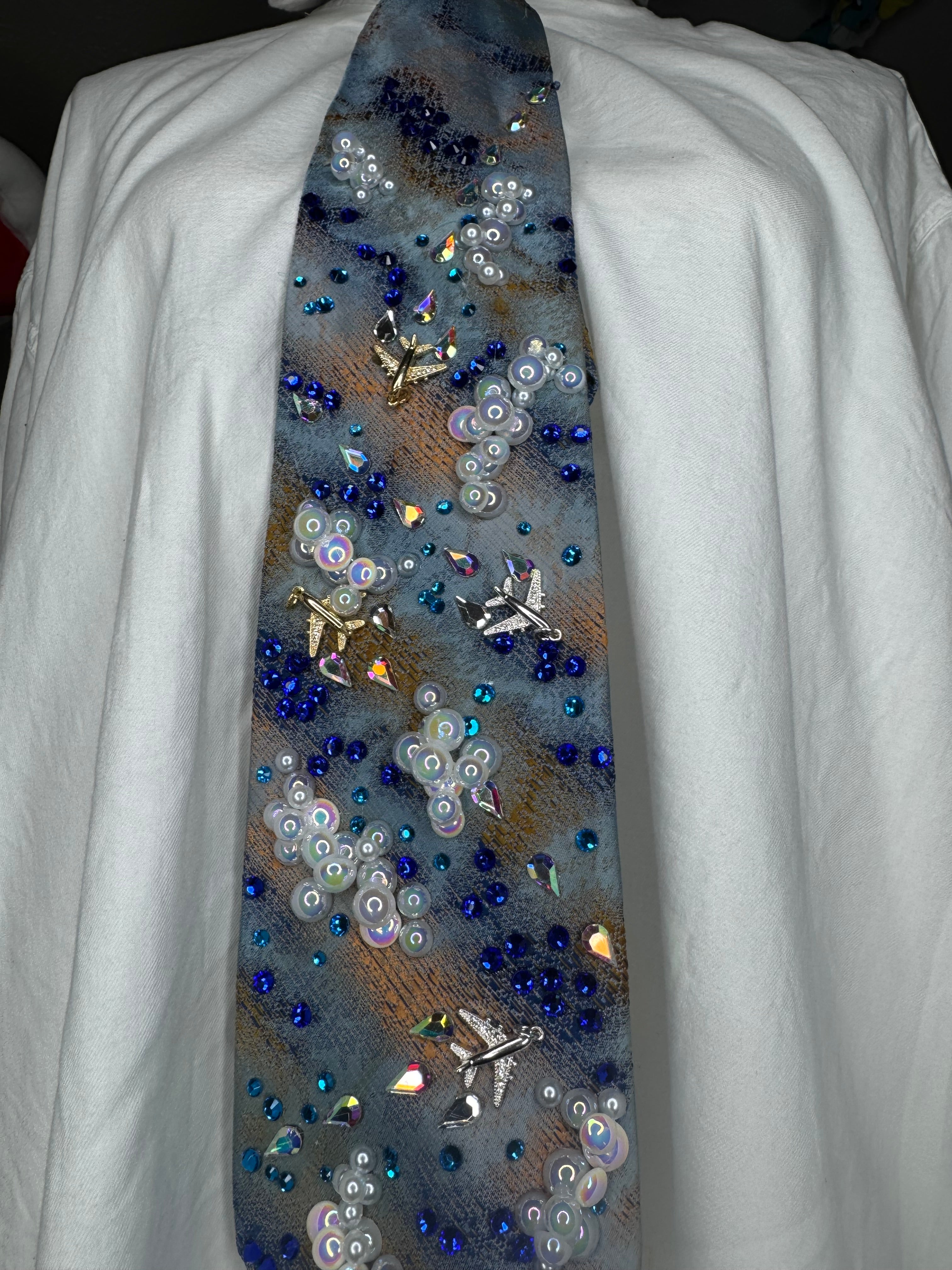 Blue and Orange Clouds and Airplanes Over Water Pilot Tie