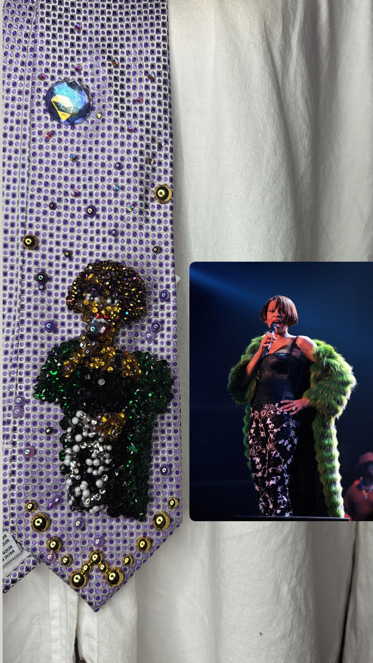 Purple Whitney Houston Performing In Black Floral Pants And Green Mink Coat Tie