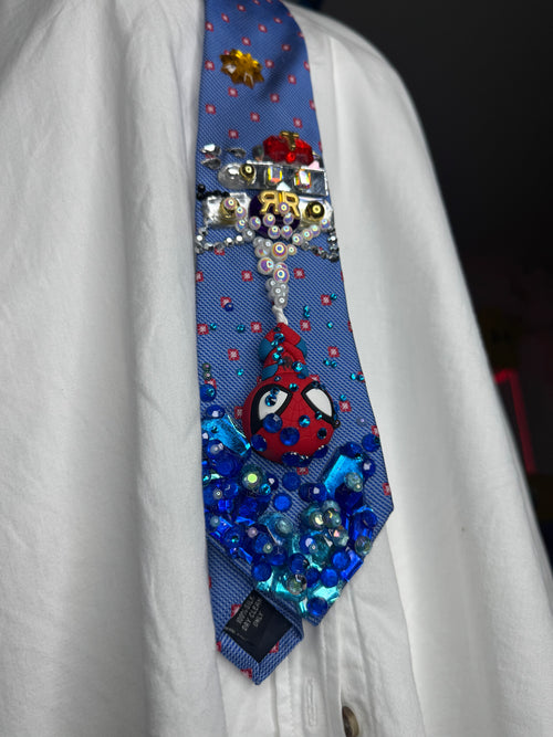 Blue Spiderman Webbing Himself Out of Water to Train Railway Tie