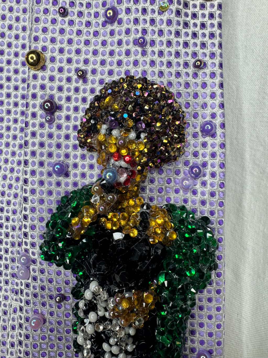 Purple Whitney Houston Performing In Black Floral Pants And Green Mink Coat Tie