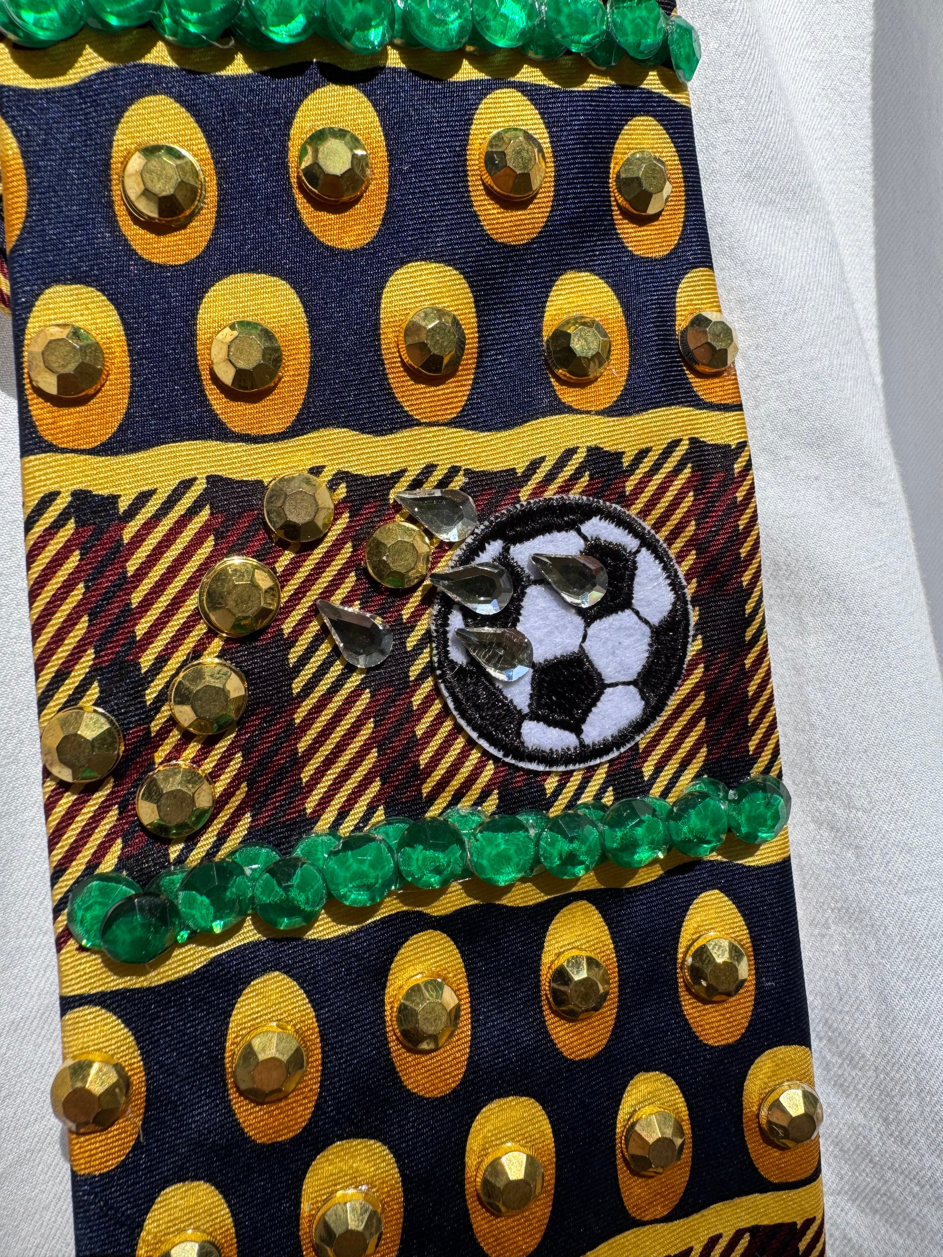 Gold and Burgundy Soccer Balls Moving Soccer Tie