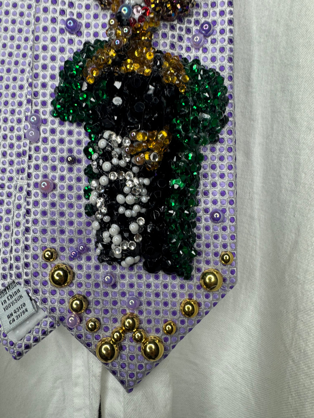 Purple Whitney Houston Performing In Black Floral Pants And Green Mink Coat Tie