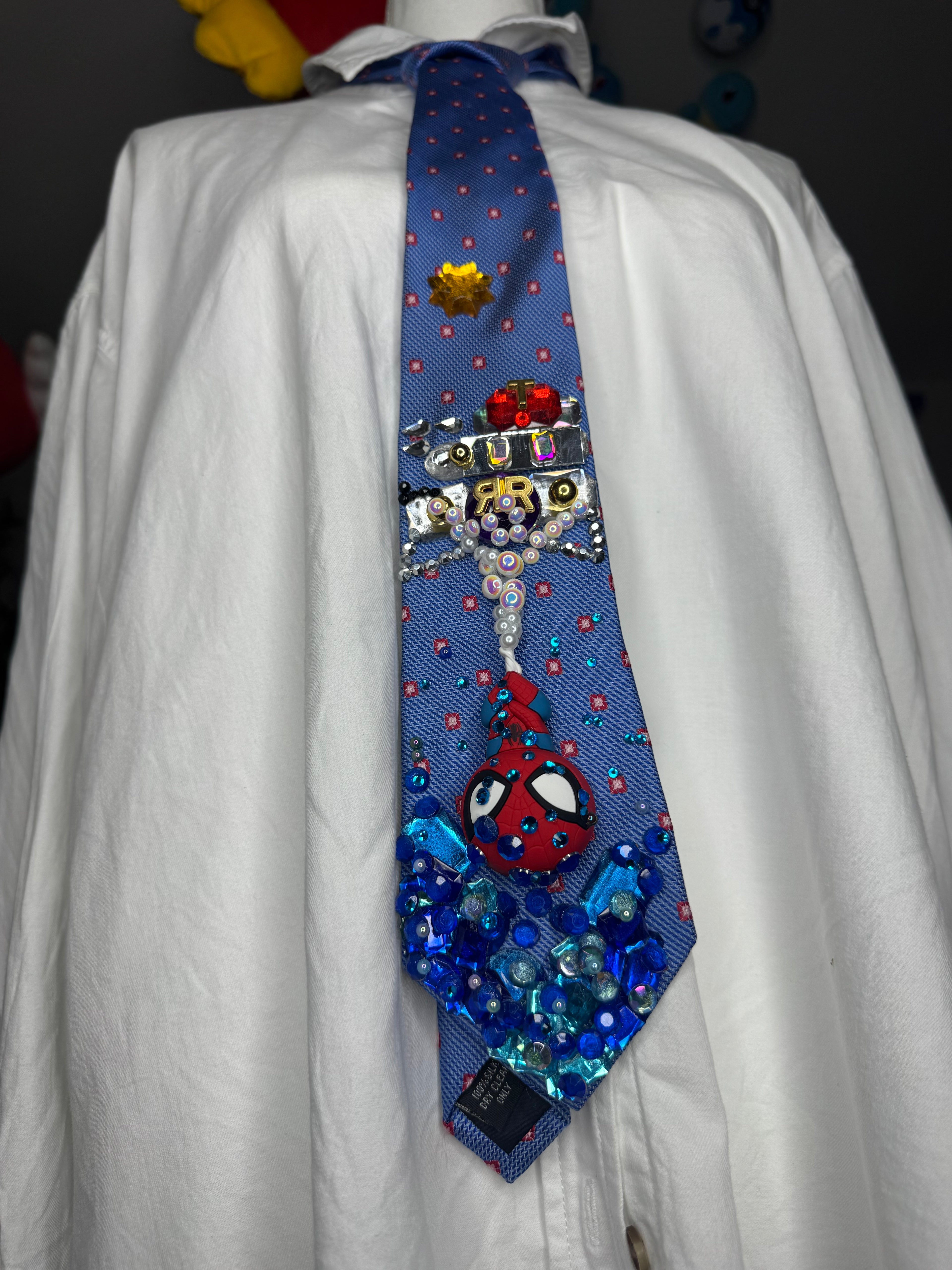 Blue Spiderman Webbing Himself Out of Water to Train Railway Tie