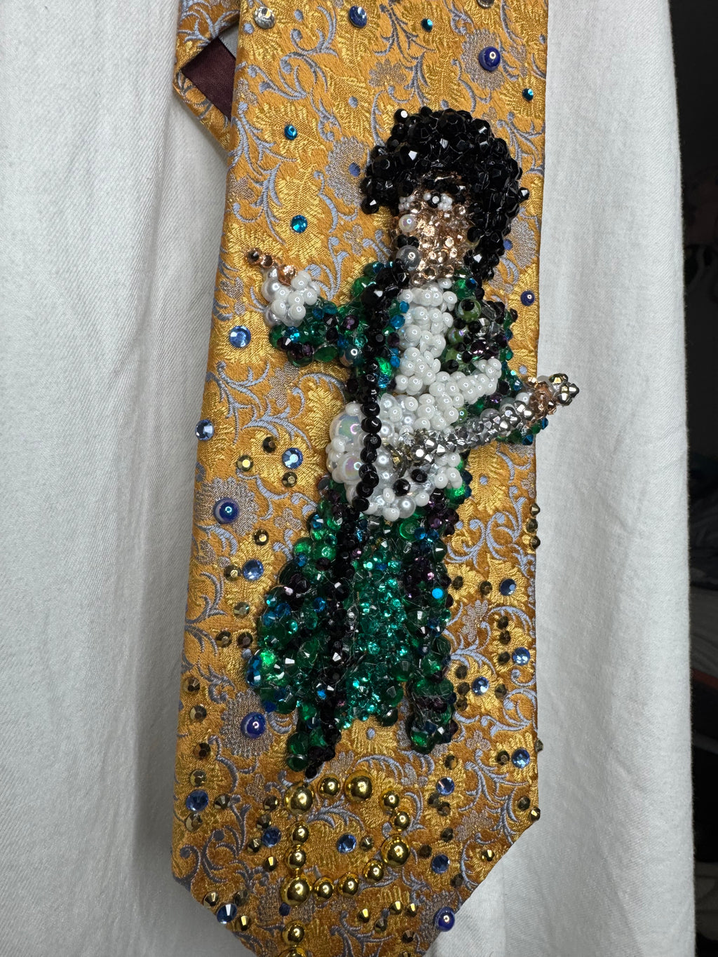 Gold Paisley Prince Pointing With White Guitar Performing Purple Rain at the AMA 1985 Tie