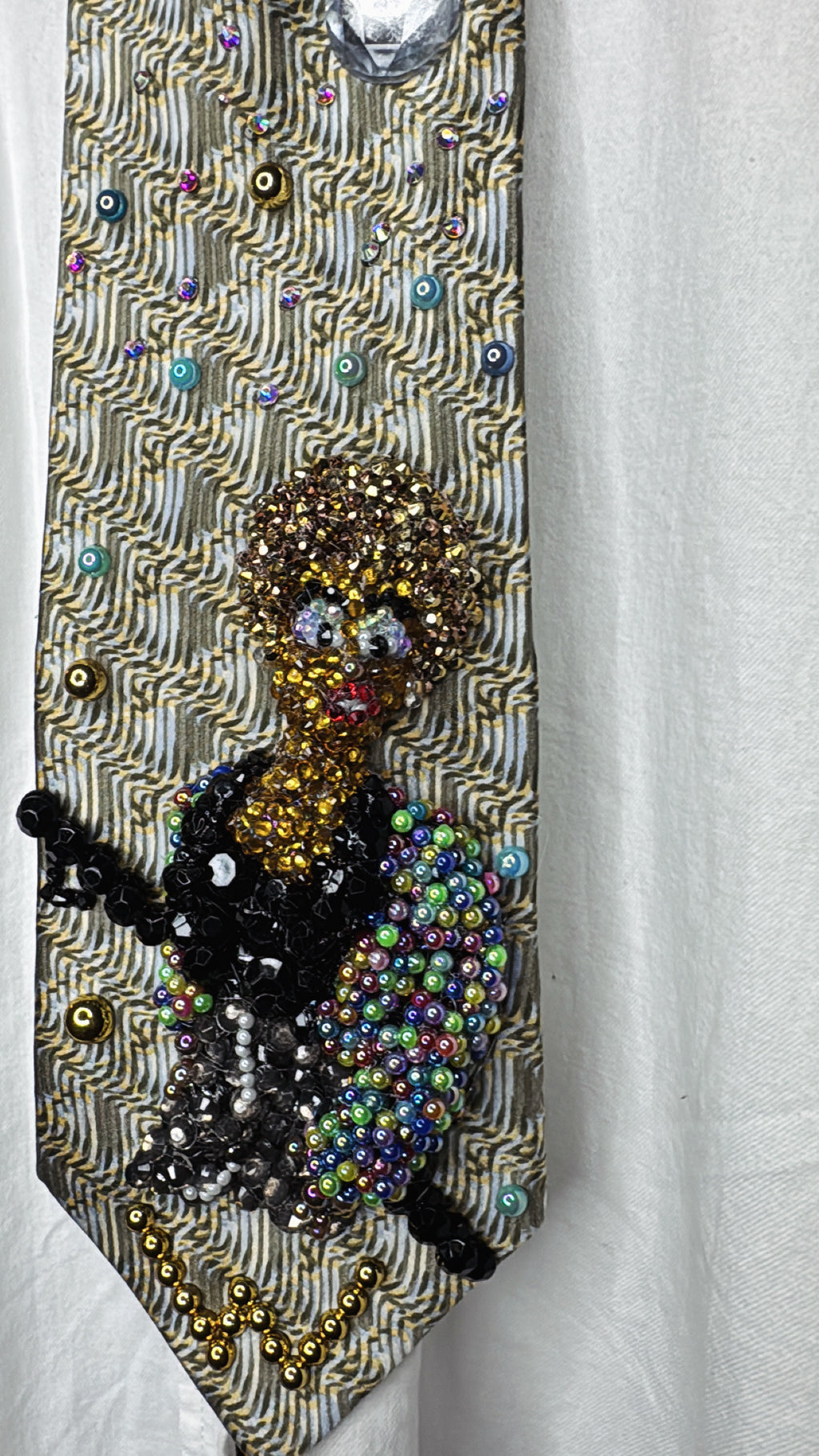 Beige Whitney Houston in Colorful Gem Jacket Posing on Staircase Tie