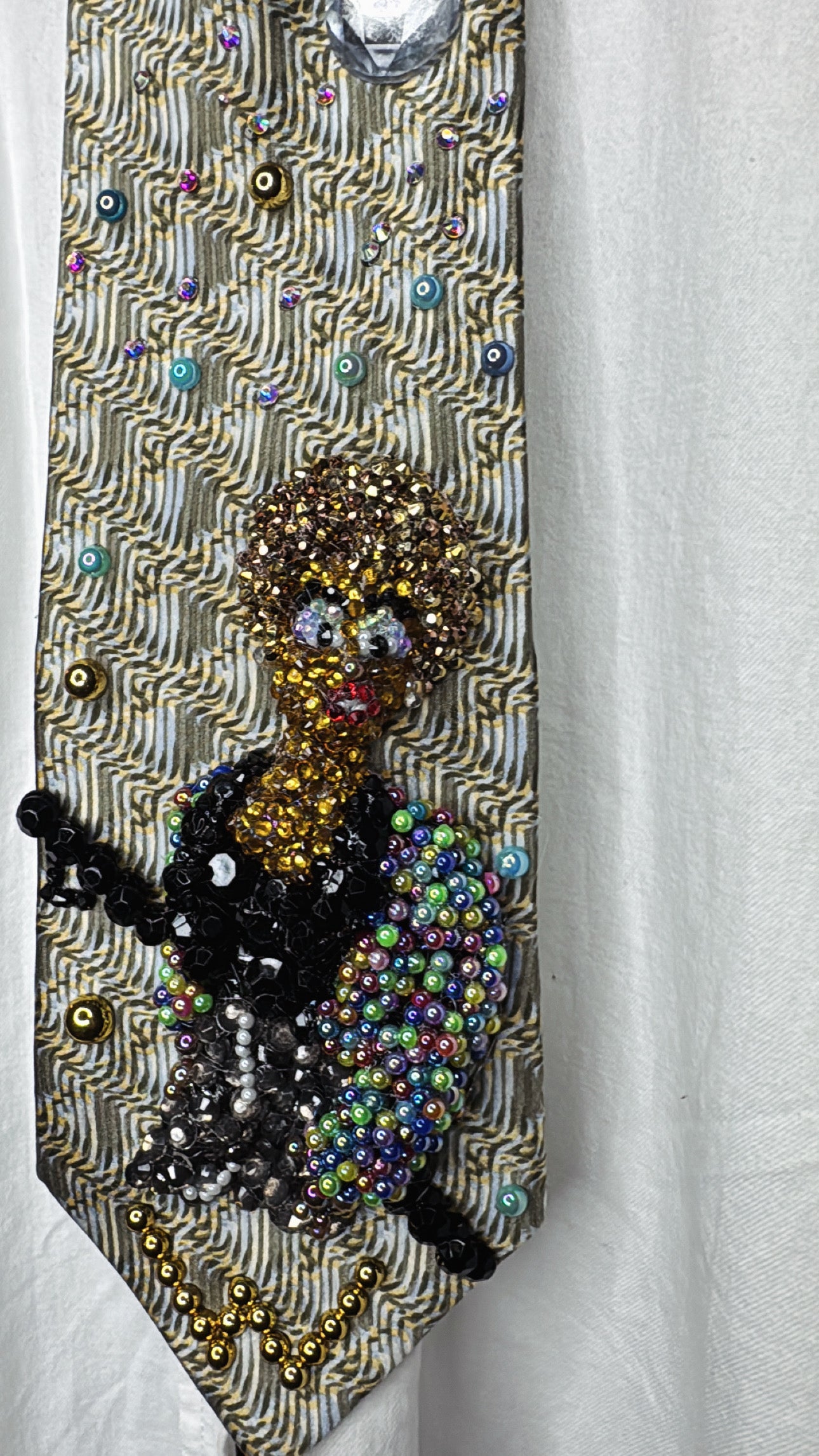 Beige Whitney Houston in Colorful Gem Jacket Posing on Staircase Tie