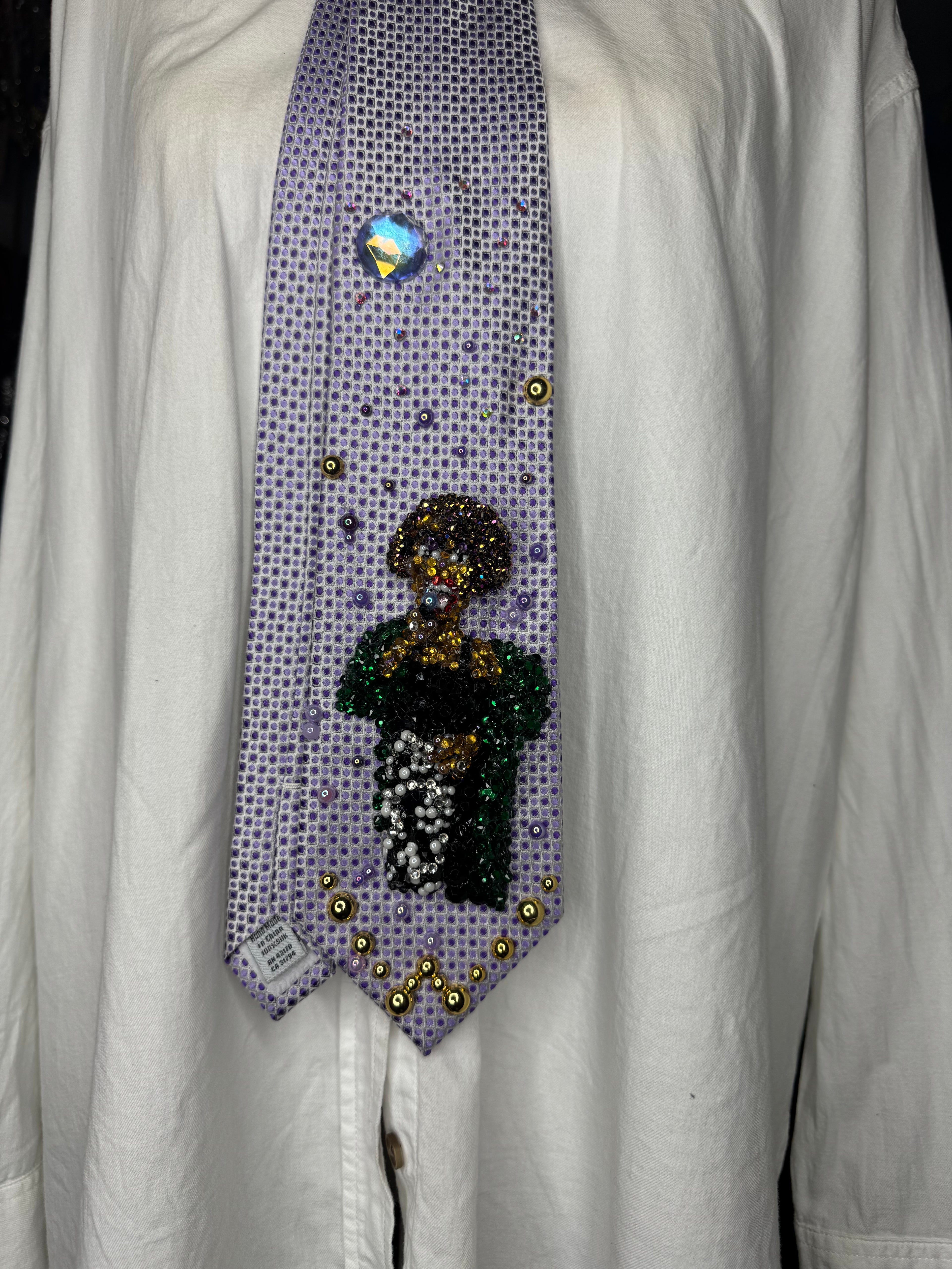 Purple Whitney Houston Performing In Black Floral Pants And Green Mink Coat Tie