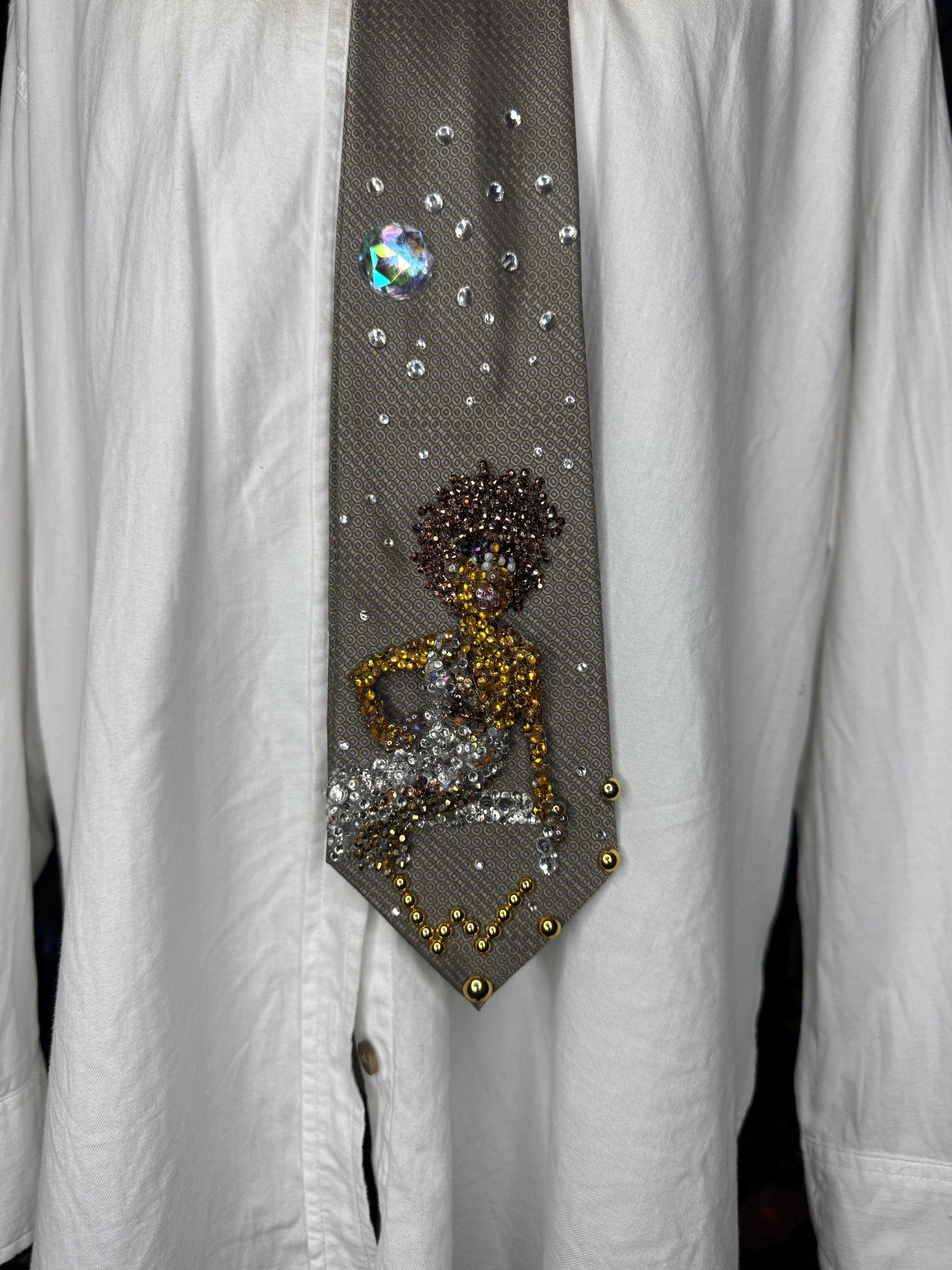 Brown Whitney Houston Posing on Clear Bench in Crystal Royalty Open Shoulder Dress For Photoshoot Tie