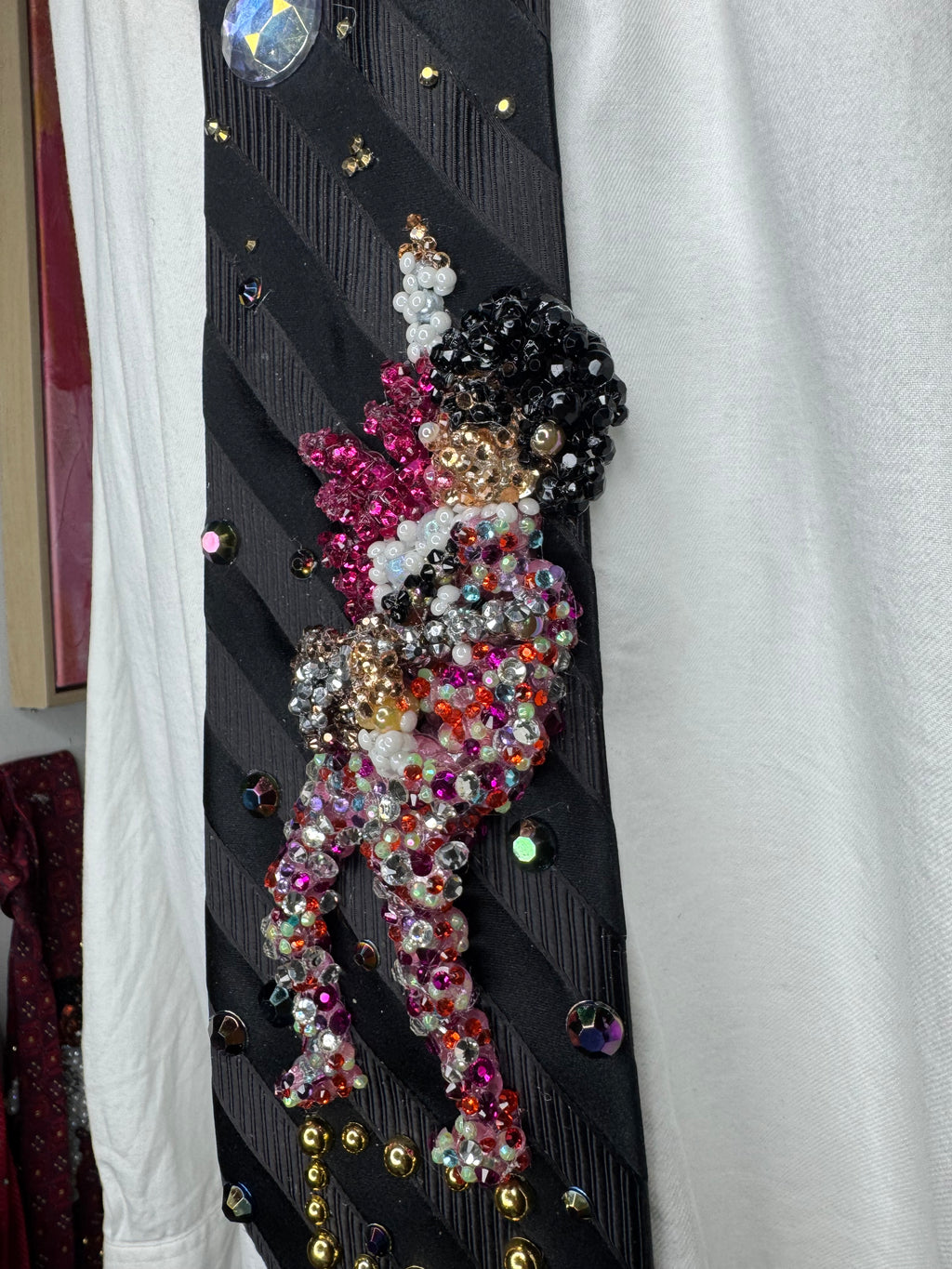 Black Striped Prince Rocking Out in Color Spotted Outfit with Pink Scarf Performing Tie