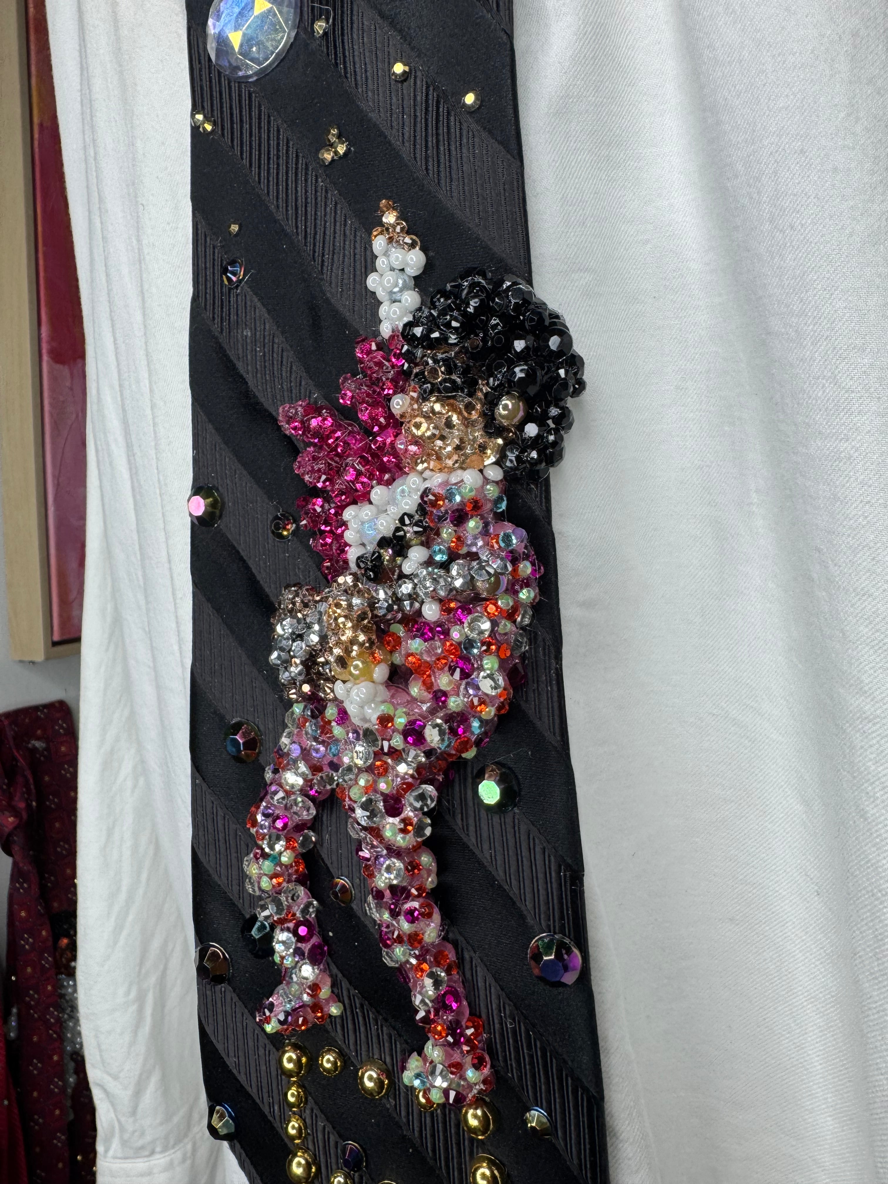 Black Striped Prince Rocking Out in Color Spotted Outfit with Pink Scarf Performing Tie