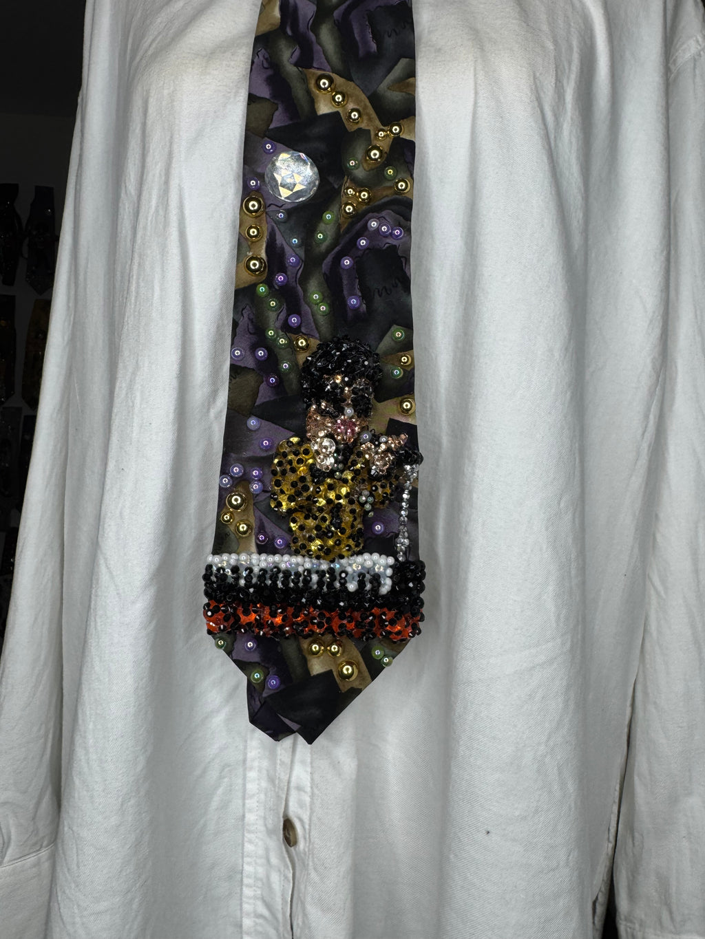 Purple Gold, and Green Marbled Prince in Full Yellow Polka Dot Suit Playing on Orange Cheetah Print Piano Live Tie