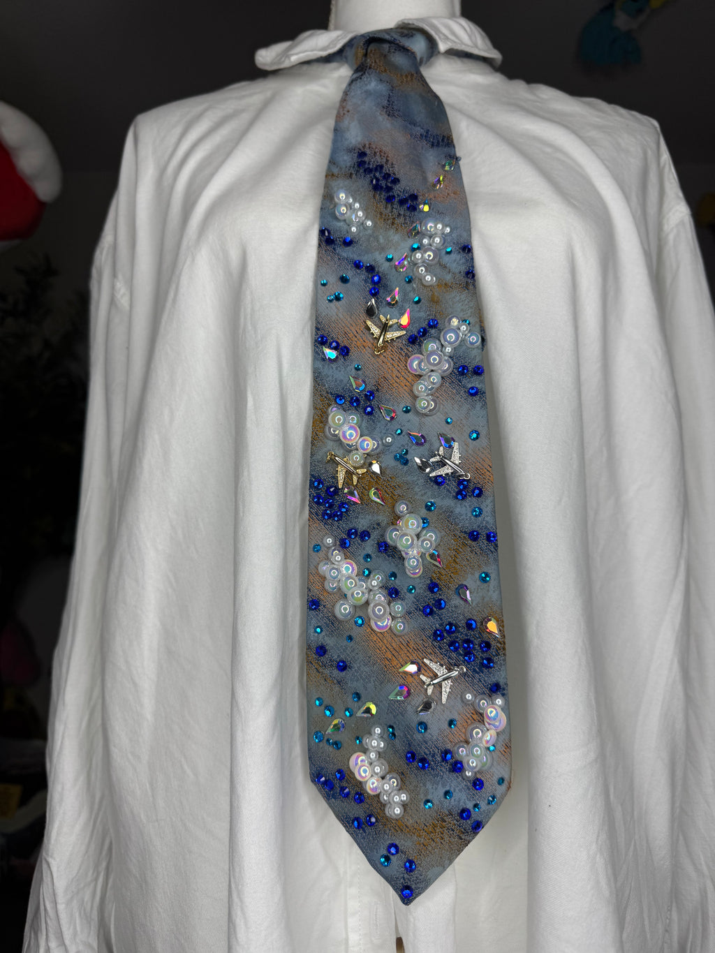 Blue and Orange Clouds and Airplanes Over Water Pilot Tie
