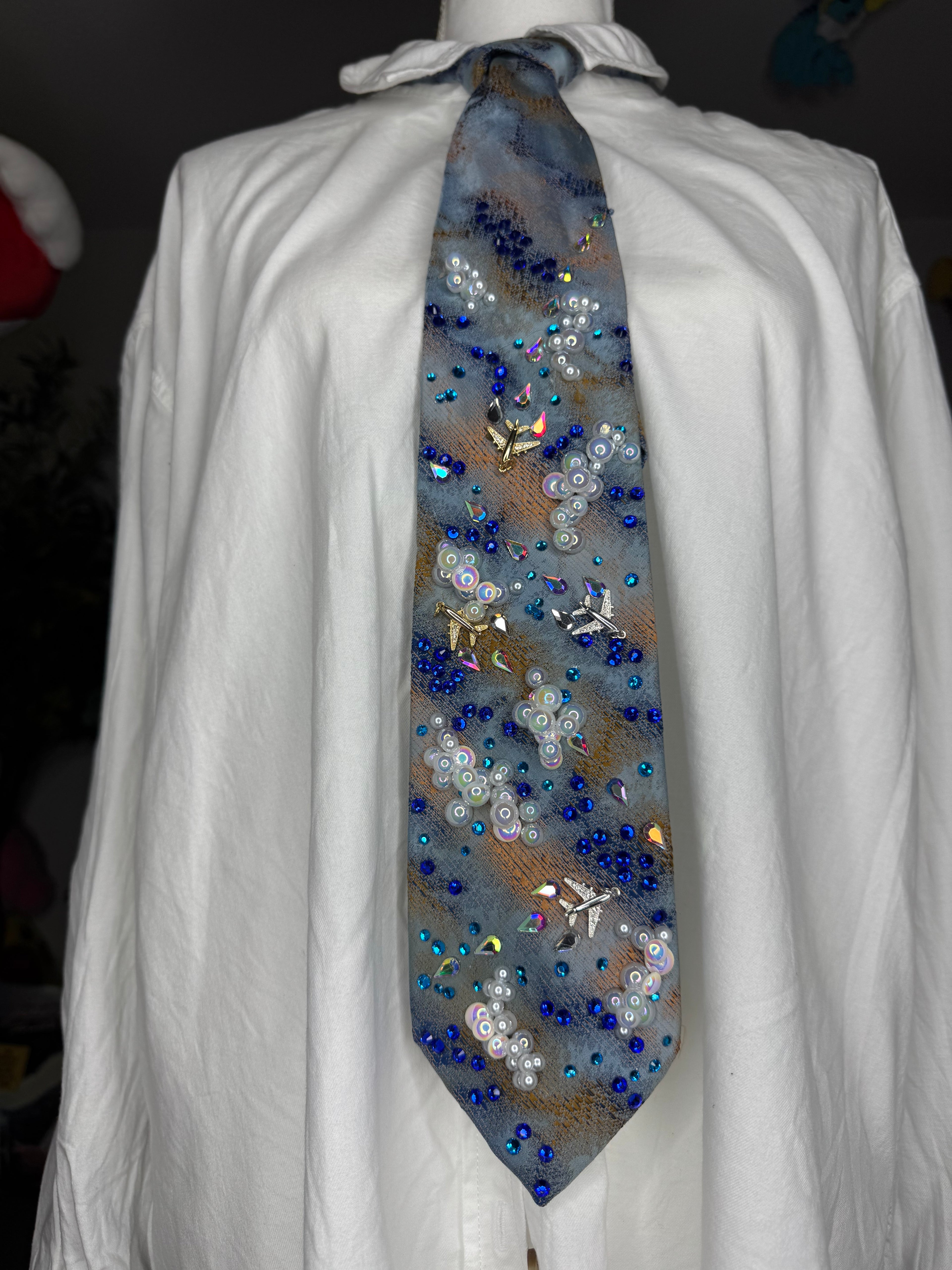 Blue and Orange Clouds and Airplanes Over Water Pilot Tie