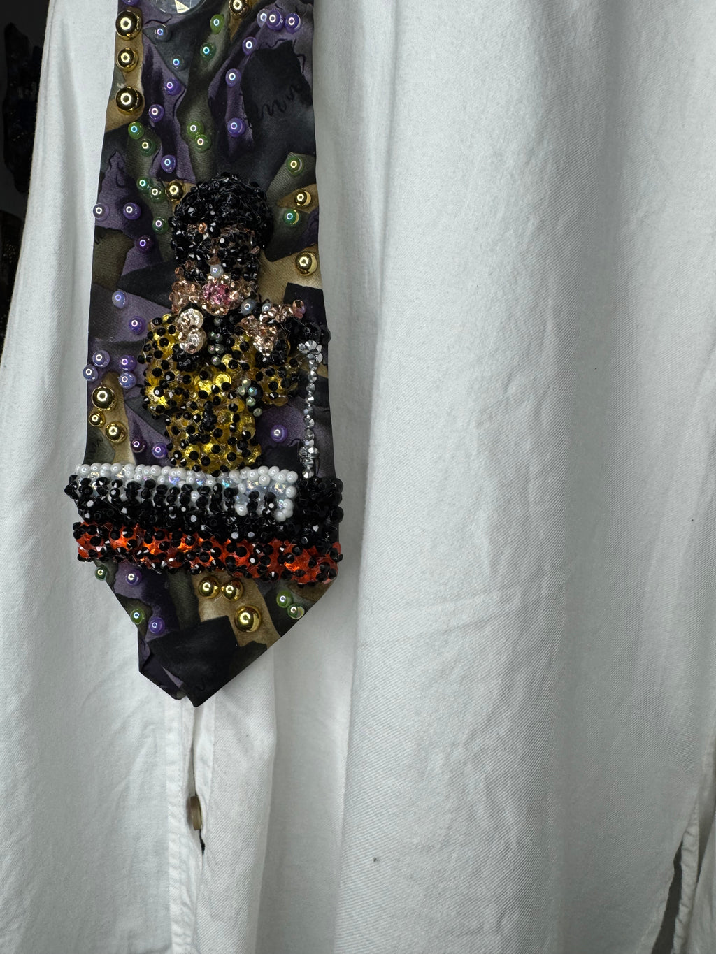 Purple Gold, and Green Marbled Prince in Full Yellow Polka Dot Suit Playing on Orange Cheetah Print Piano Live Tie