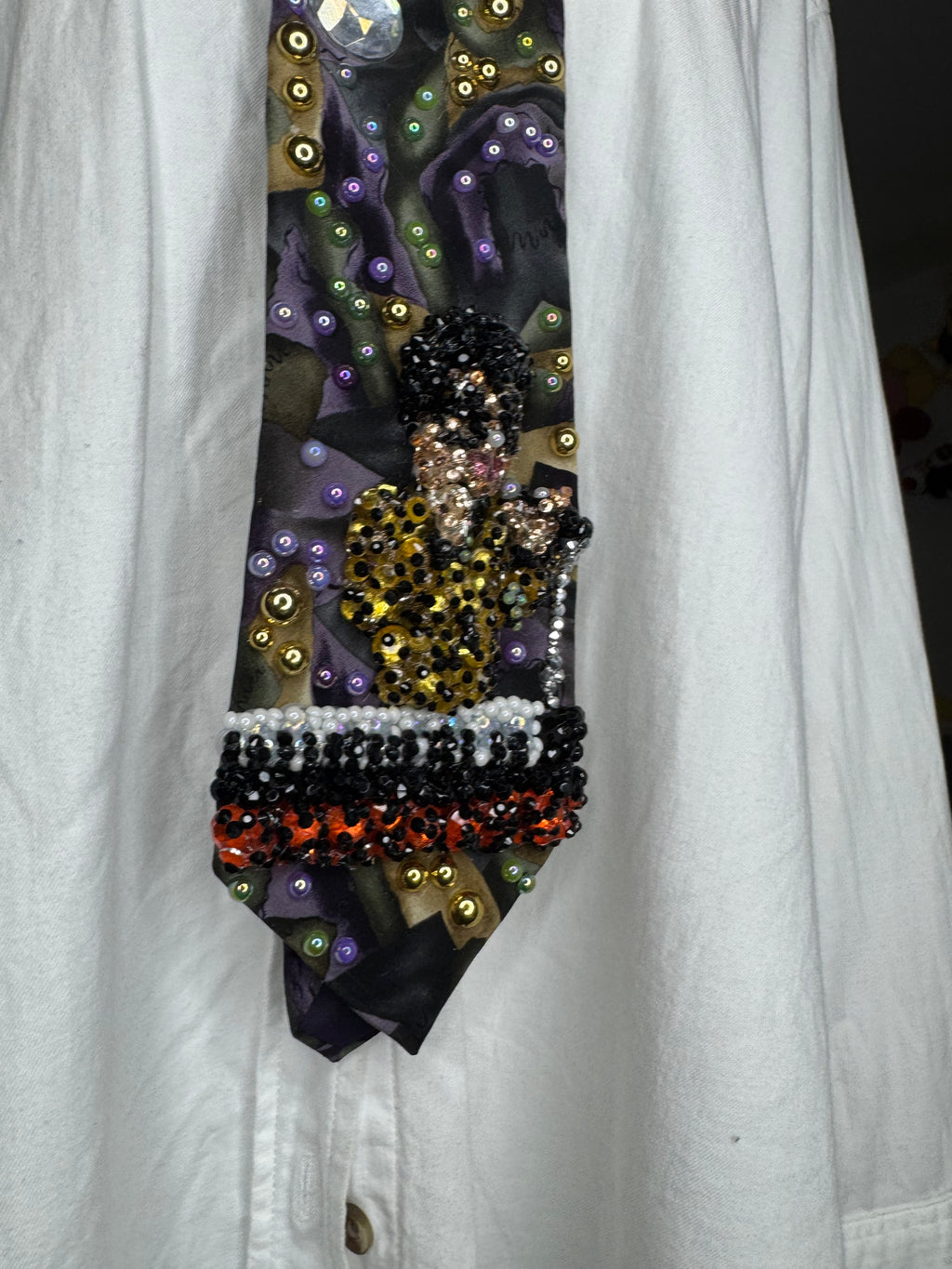 Purple Gold, and Green Marbled Prince in Full Yellow Polka Dot Suit Playing on Orange Cheetah Print Piano Live Tie