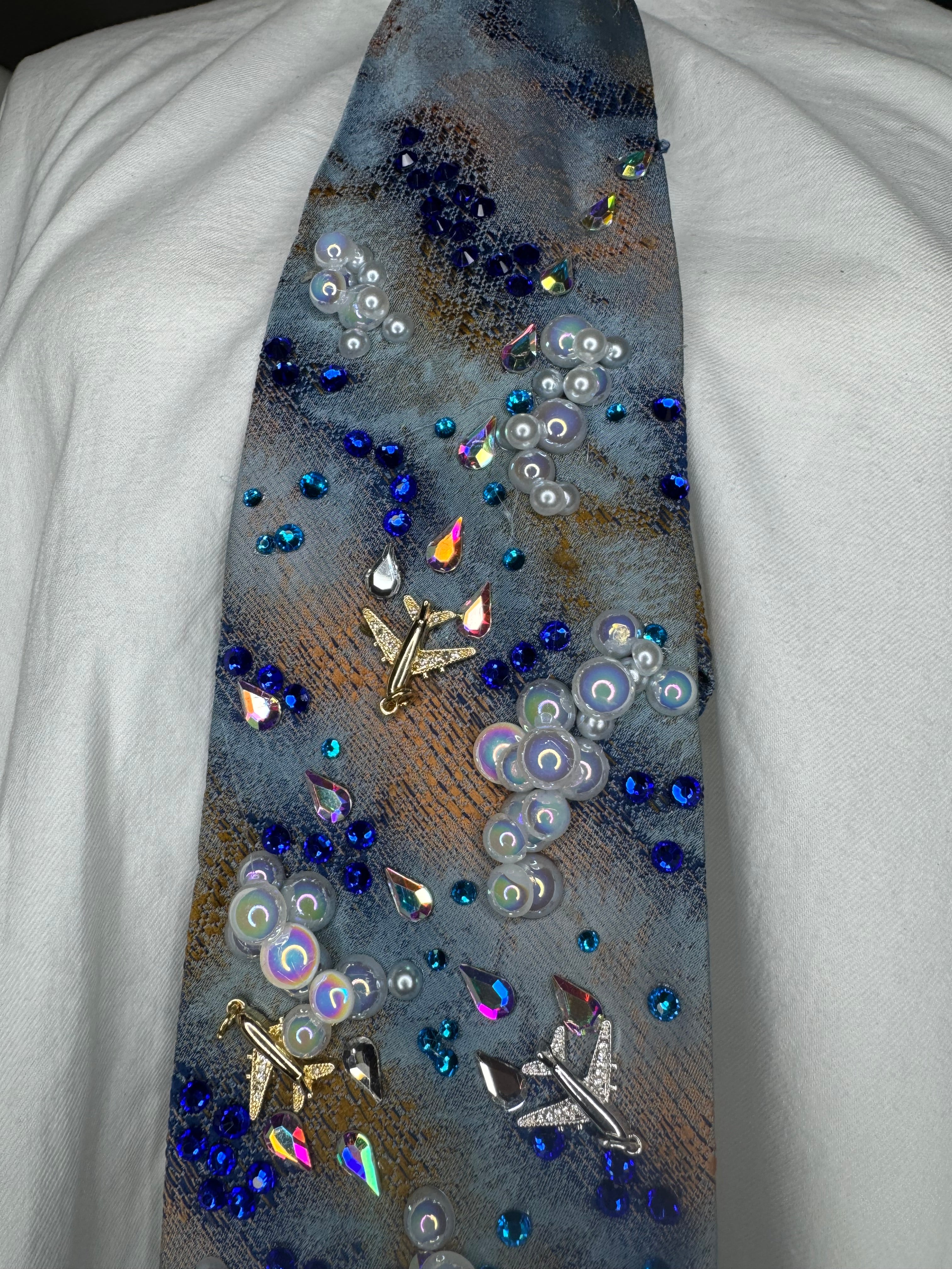 Blue and Orange Clouds and Airplanes Over Water Pilot Tie