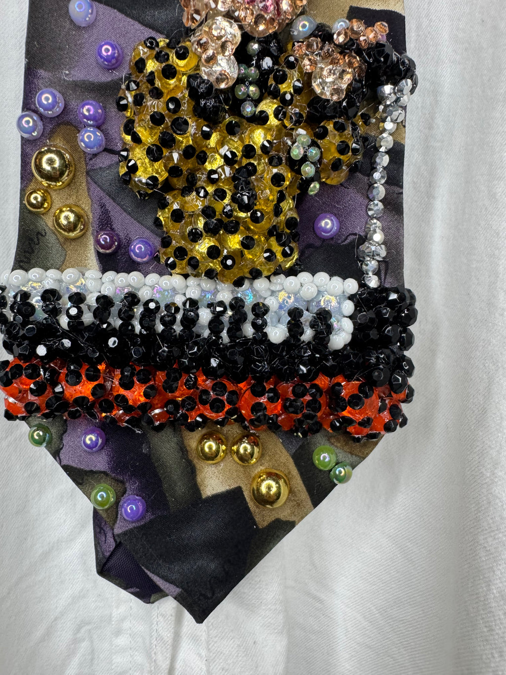 Purple Gold, and Green Marbled Prince in Full Yellow Polka Dot Suit Playing on Orange Cheetah Print Piano Live Tie