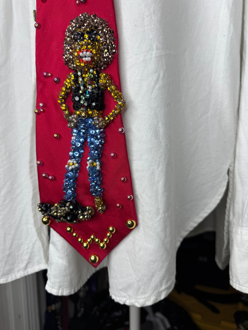 Red silk Whitney Houston with Hands Hip, Smiling with Jacket on Floor Photo shoot Tie